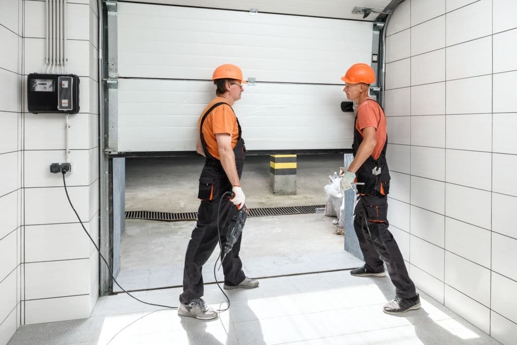 Workers Repairing Garage Door