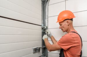 Man Repairing Garage Door