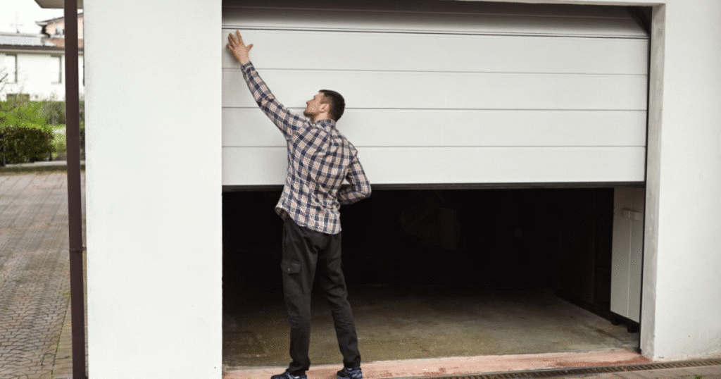 man in an open garage door